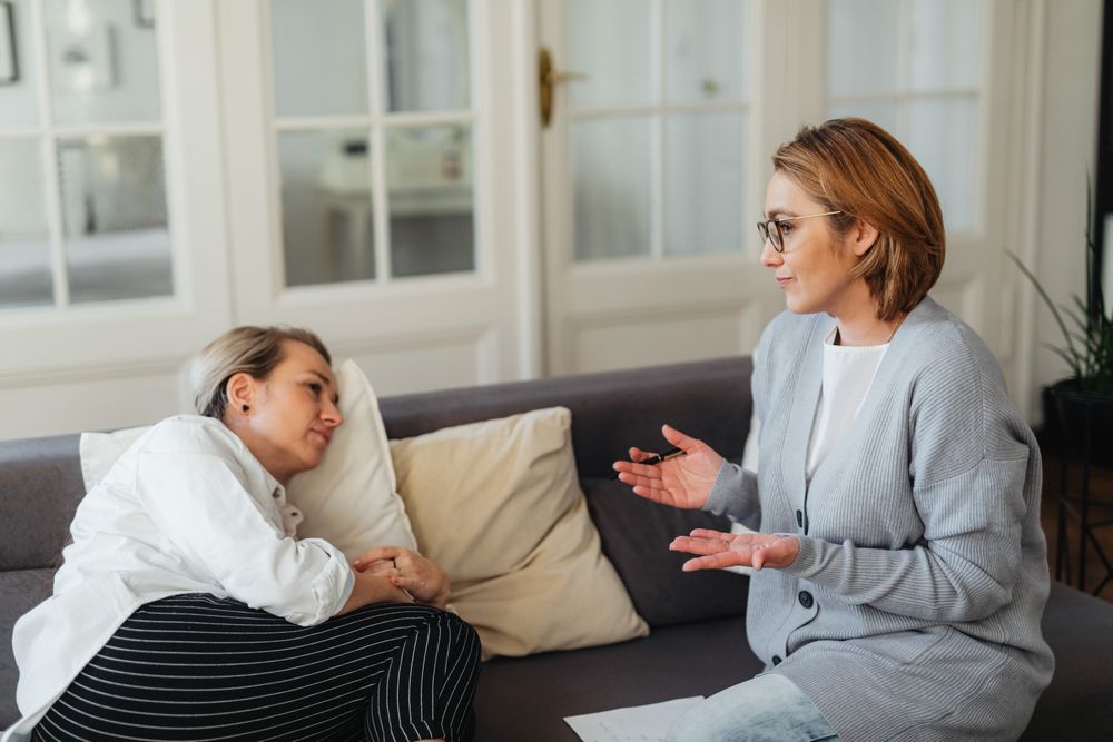 Two people in a supportive relationship counseling conversation
